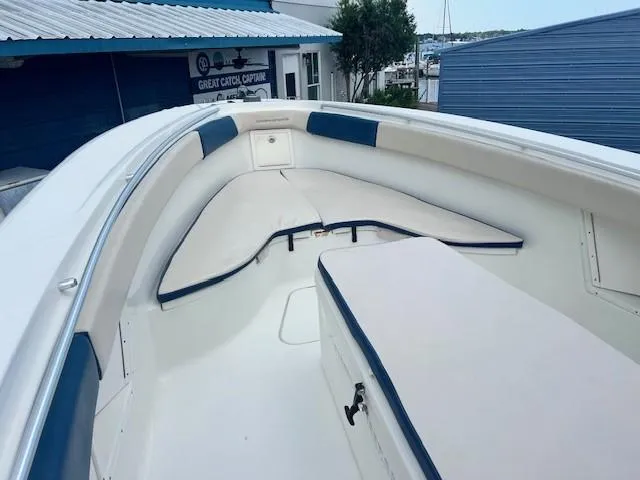 Slide: The Image of 2006 Hydra-Sports Vector 3300 CC boat interior with cushioned seating and storage. - 21