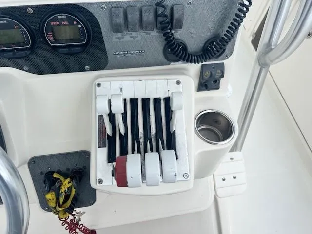 Slide: The Image of Control panel of a 2006 Hydra-Sports Vector 3300 CC boat with throttle levers. - 24