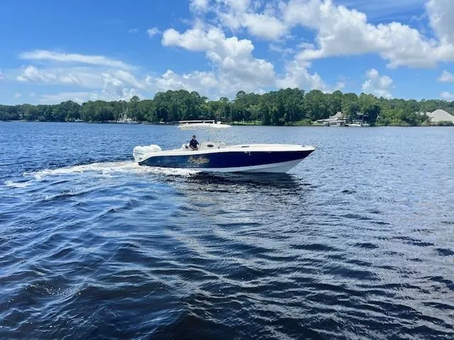 Slide: The Image of 2006 Hydra-Sports Vector 3300 CC cruising on a sunny lake with lush green shoreline. - 5