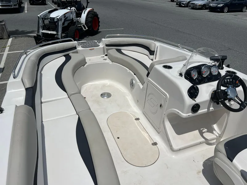 Slide: The Image of 2021 Starcraft Limited 1915 OB boat interior with seating and control panel. - 10