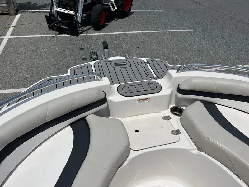 Slide: The Image of 2021 Starcraft Limited 1915 OB boat interior with cushioned seating and deck details. - 13