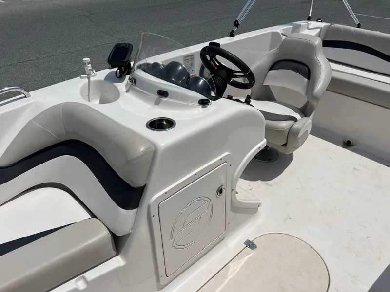 Slide: The Image of 2021 Starcraft Limited 1915 OB boat interior with steering console and seating. - 14