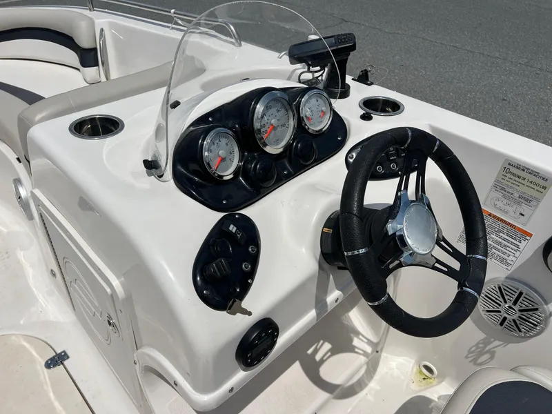 Slide: The Image of 2021 Starcraft Limited 1915 OB boat dashboard with steering wheel and gauges. - 15