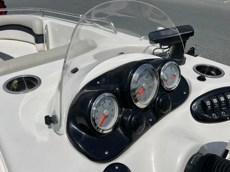 Slide: The Image of 2021 Starcraft Limited 1915 OB boat dashboard with gauges and controls. - 16