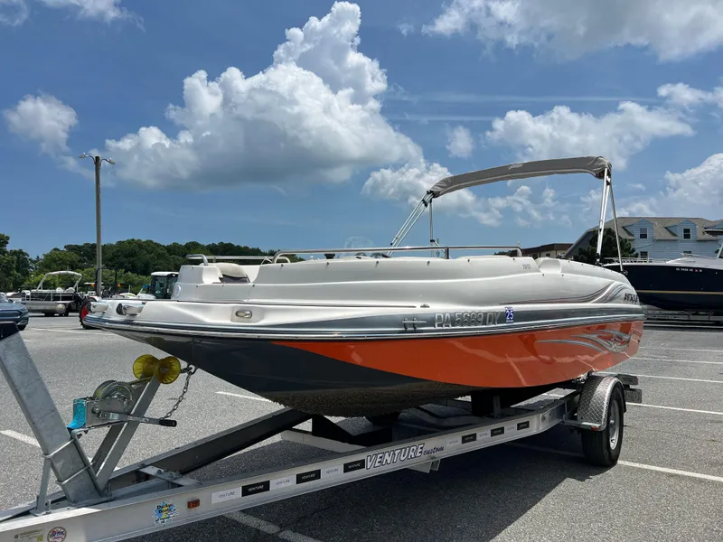 Slide: The Image of 2021 Starcraft Limited 1915 OB boat on trailer under a cloudy sky. - 6