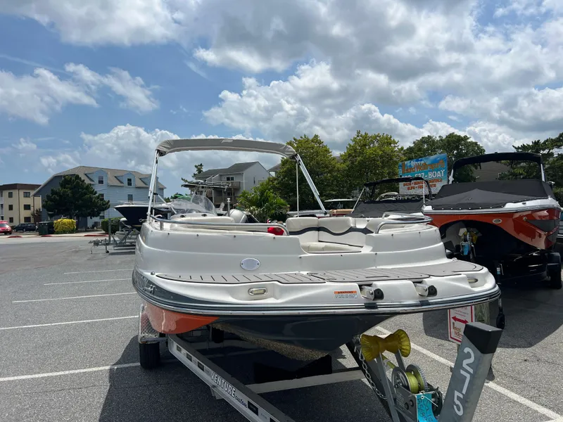 Slide: The Image of 2021 Starcraft Limited 1915 OB boat on trailer in parking lot under cloudy sky. - 7