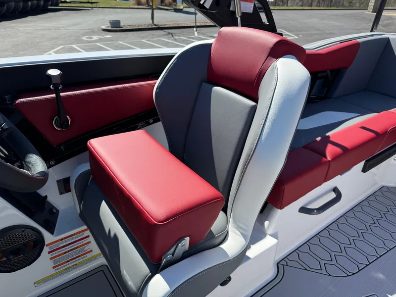 Slide: The Image of 2025 MasterCraft NXT22 boat interior with red and gray seating. - 19