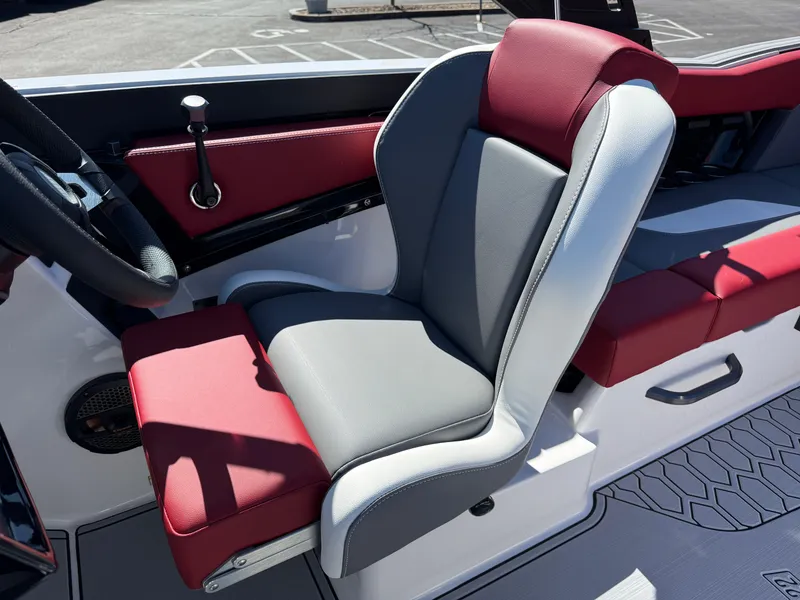 Slide: The Image of 2025 MasterCraft NXT22 boat interior with red and gray seating. - 20
