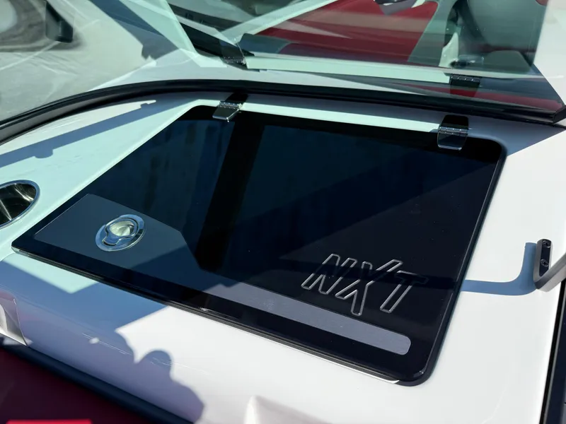 Slide: The Image of 2025 MasterCraft NXT22 boat dashboard with sleek design and modern features. - 24