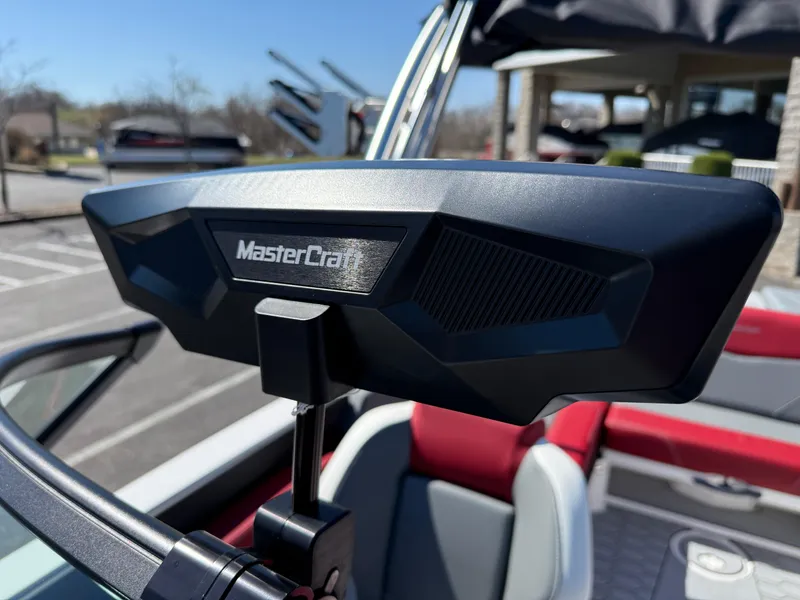 Slide: The Image of 2025 MasterCraft NXT22 boat rearview mirror, close-up view. - 26