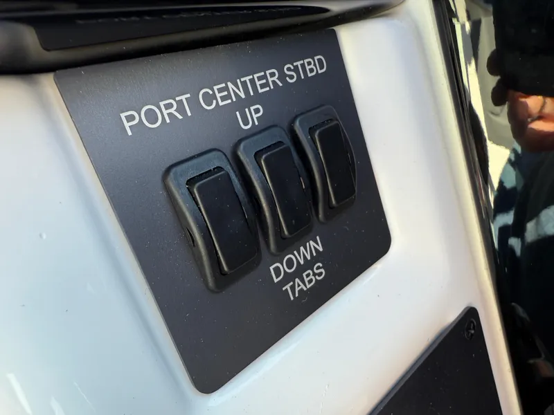 Slide: The Image of Control panel of 2025 MasterCraft NXT22 boat with toggle switches. - 38