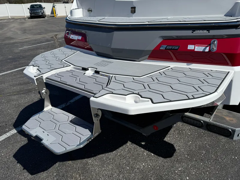 Slide: The Image of 2025 MasterCraft NXT22 boat rear view with swim platform and SurfStar system. - 4