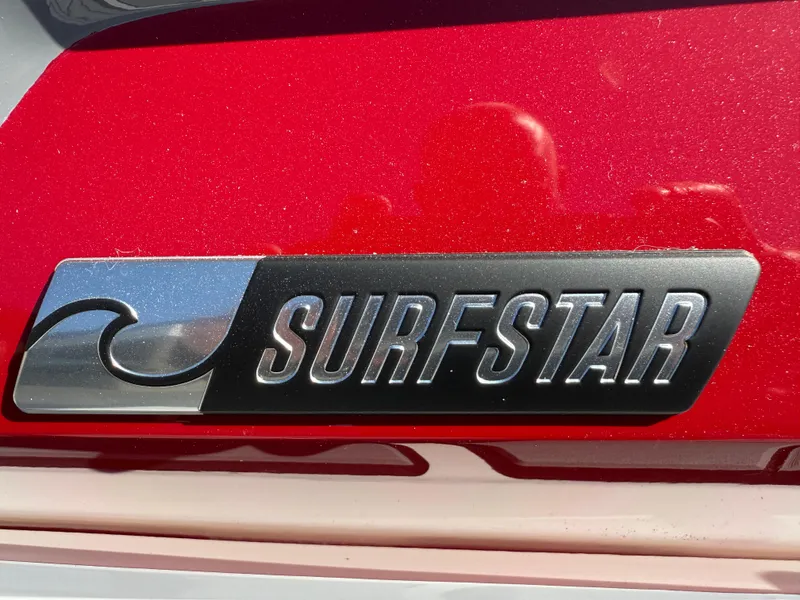Slide: The Image of 2025 MasterCraft NXT22 SurfStar logo on red background. - 5