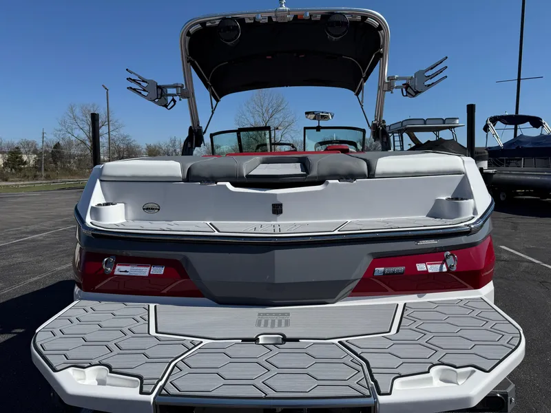 Slide: The Image of 2025 MasterCraft NXT22 boat rear view with swim platform and wakeboard tower. - 6