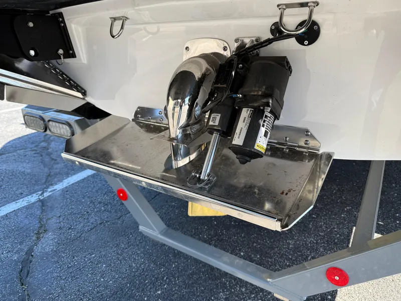 Slide: The Image of 2025 MasterCraft NXT22 boat stern with propeller and trim tab detail. - 7
