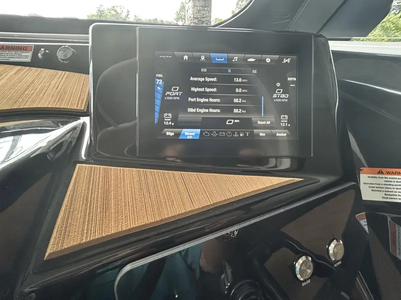 Slide: The Image of 2024 Yamaha Boats 222 S dashboard with digital display showing speed and engine data. - 6