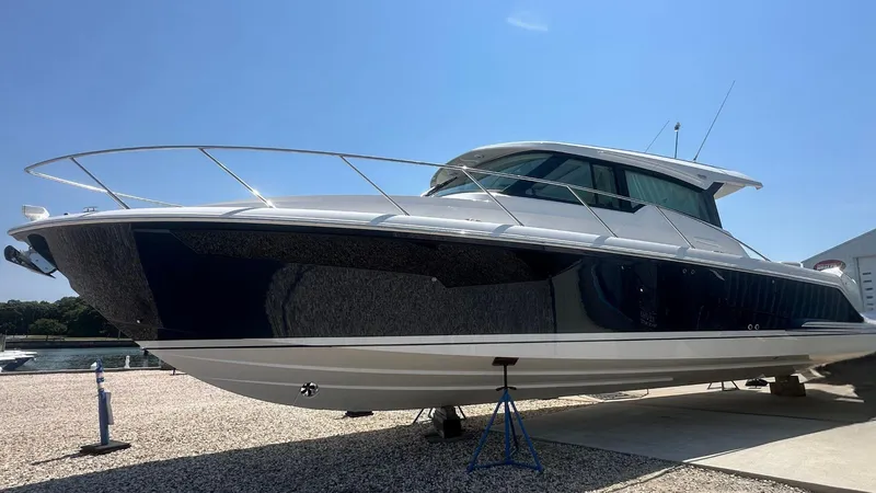 The Image of 2026 Tiara Yachts 43 LE on display, sleek design, docked outdoors. - 0