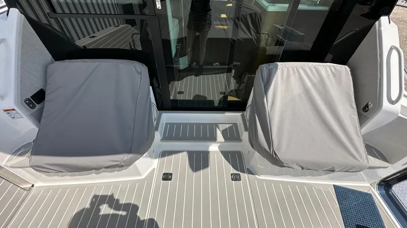 Slide: The Image of 2026 Tiara Yachts 43 LE cockpit with covered seats and sleek flooring. - 14