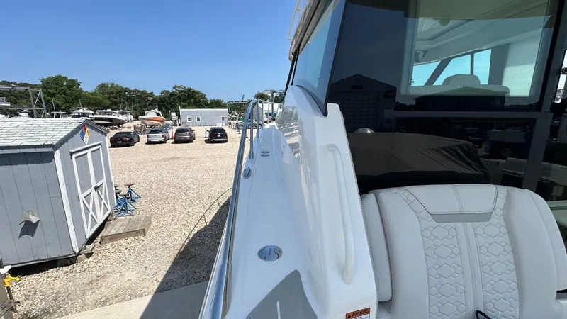 Slide: The Image of 2026 Tiara Yachts 43 LE docked, showcasing sleek design and luxurious seating. - 21