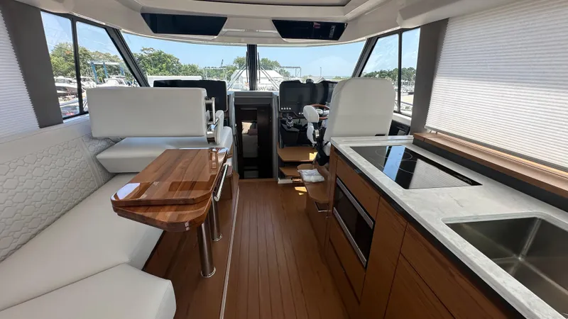 Slide: The Image of Luxurious interior of 2026 Tiara Yachts 43 LE, featuring modern kitchen and seating area. - 23