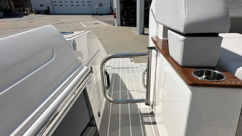 Slide: The Image of 2026 Tiara Yachts 43 LE boat interior with sleek seating and stainless steel cup holder. - 3
