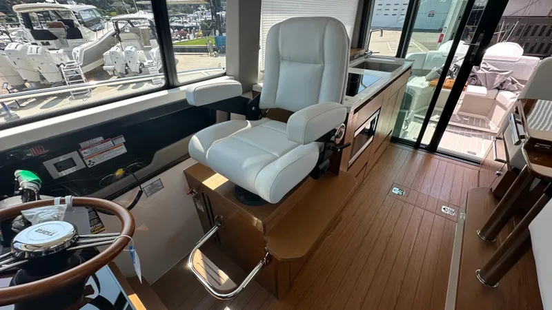 Slide: The Image of 2026 Tiara Yachts 43 LE interior with captain's chair and helm station. - 31