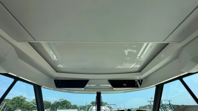 Slide: The Image of Interior view of 2026 Tiara Yachts 43 LE, showcasing sleek ceiling design and windows. - 37