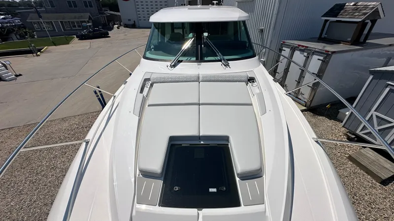 Slide: The Image of 2026 Tiara Yachts 43 LE boat deck view at a marina. - 48