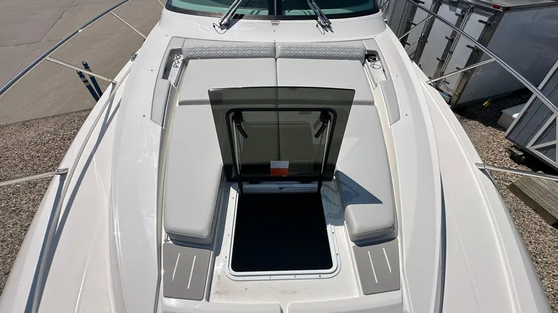 Slide: The Image of 2026 Tiara Yachts 43 LE deck with open hatch and cushioned seating. - 49