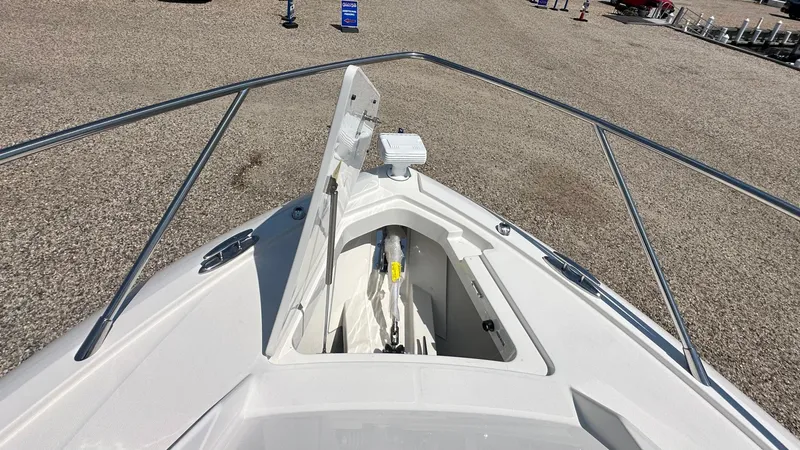 Slide: The Image of 2026 Tiara Yachts 43 LE bow with open anchor compartment, showcasing sleek design. - 51