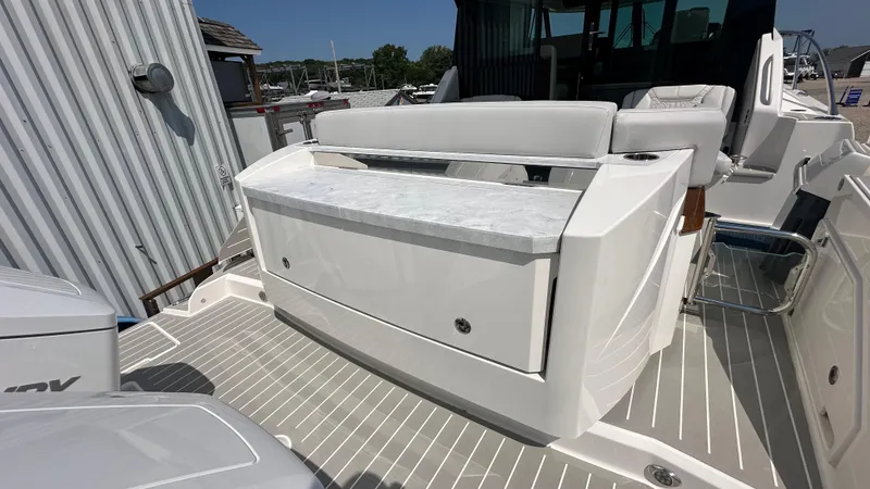 Slide: The Image of 2026 Tiara Yachts 43 LE boat interior with sleek seating and modern design. - 7