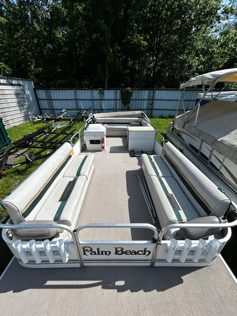 Slide: The Image of 2007 Palm Beach Sport Cruise 2423 pontoon boat with spacious seating and outdoor storage. - 5