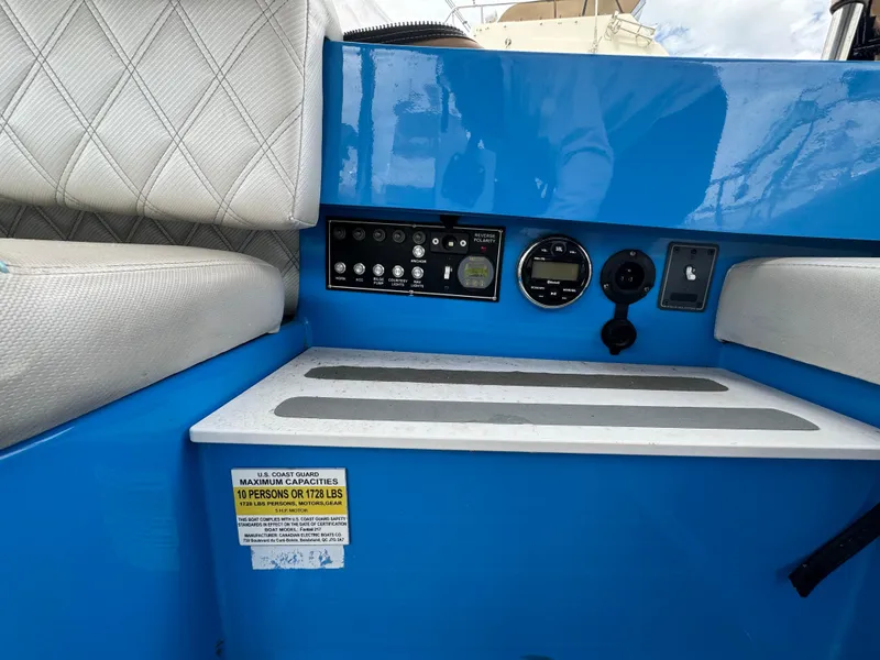 Slide: The Image of 2019 Vision Marine Technologies Fantail 217 boat interior with control panel and seating. - 15