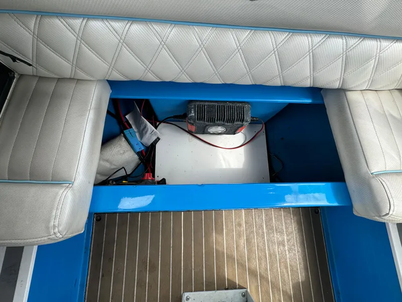 Slide: The Image of Interior view of 2019 Vision Marine Technologies Fantail 217 boat, showcasing seating and storage area. - 16