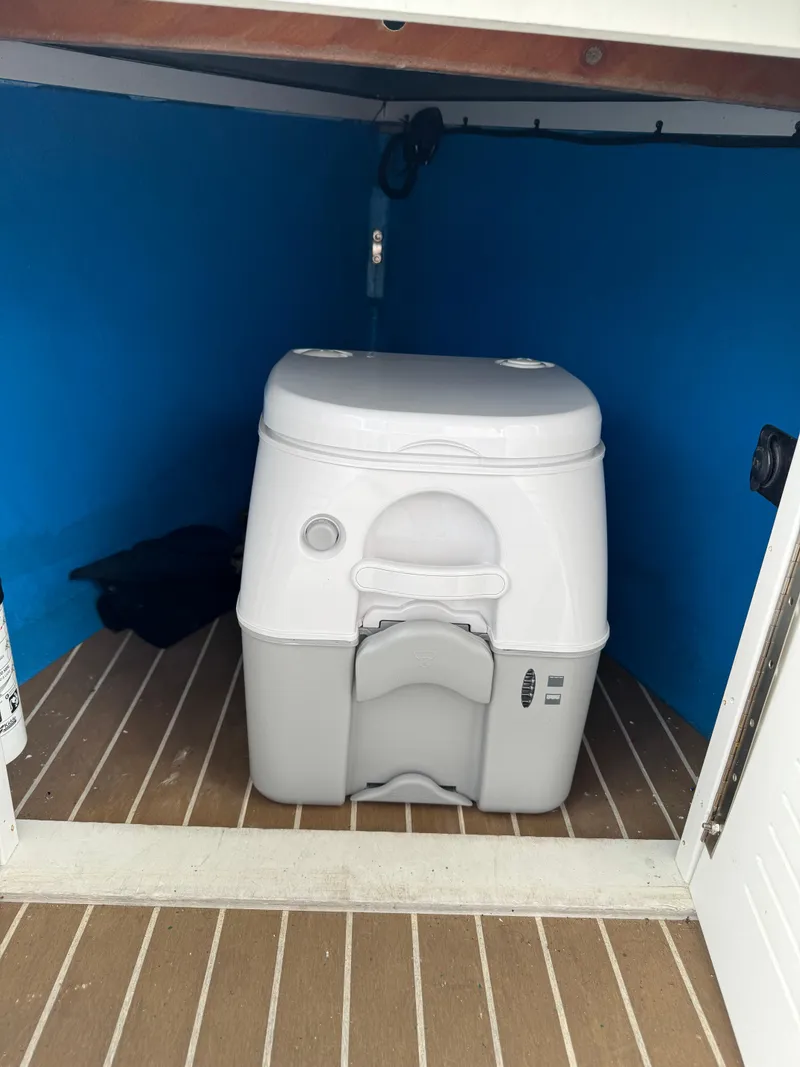 Slide: The Image of Portable toilet inside Vision Marine Technologies Fantail 217 boat, 2019 model. - 17