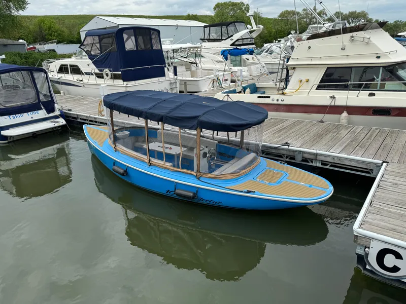 Slide: The Image of Blue 2019 Vision Marine Technologies Fantail 217 boat docked at a marina. - 7
