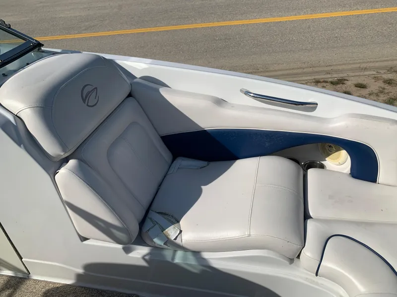 Slide: The Image of 2012 Crownline Eclipse E4 boat interior seating with white and blue upholstery. - 22