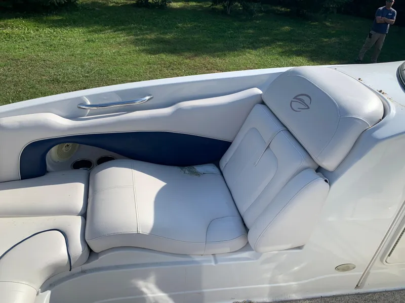 Slide: The Image of 2012 Crownline Eclipse E4 boat with white and blue seating. - 24