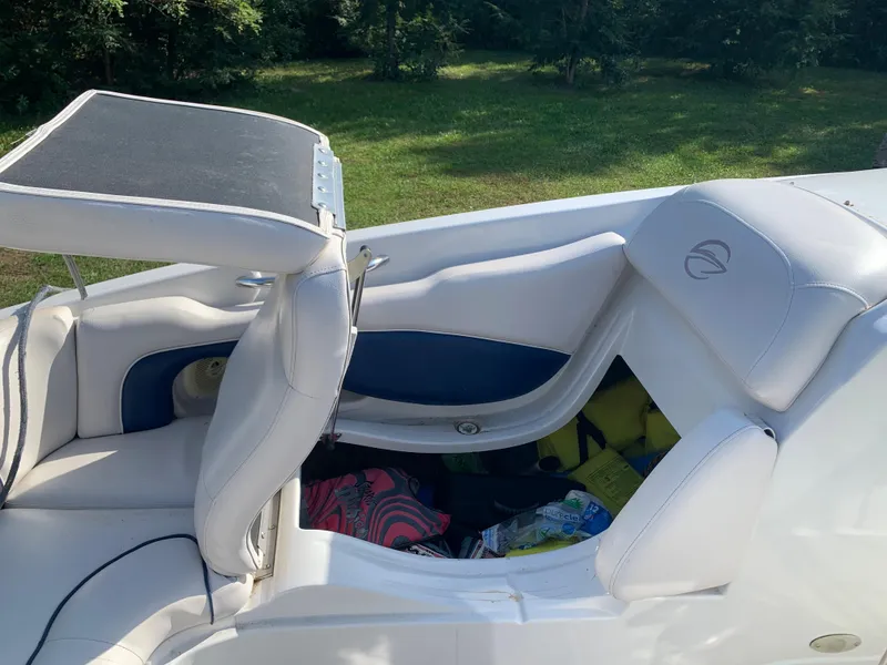 Slide: The Image of 2012 Crownline Eclipse E4 boat interior with white and blue seating. - 25
