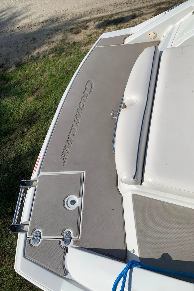 Slide: The Image of 2012 Crownline Eclipse E4 boat deck with logo and seating area. - 3