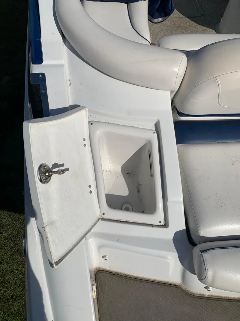 Slide: The Image of 2012 Crownline Eclipse E4 boat with open storage compartment. - 5