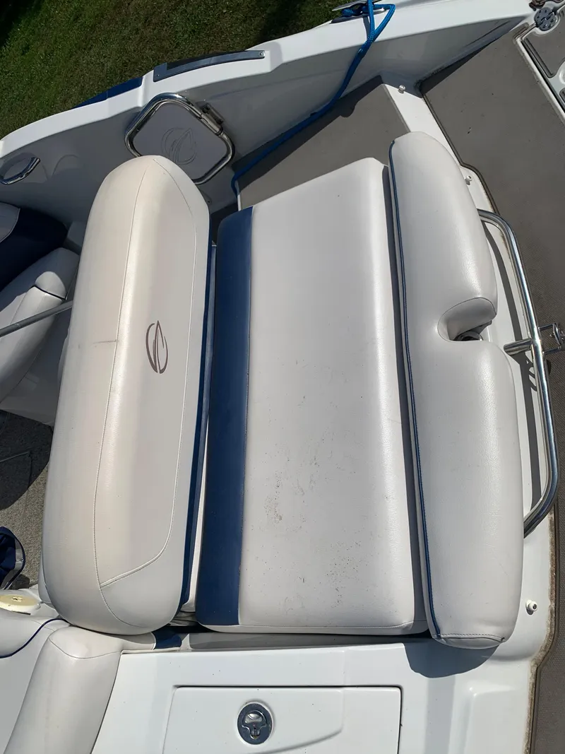 Slide: The Image of 2012 Crownline Eclipse E4 boat with white cushioned seating. - 6