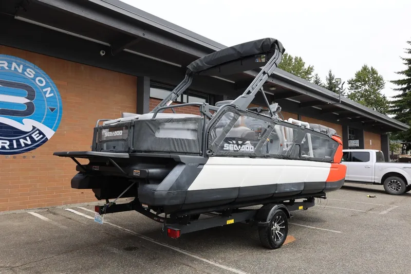 Slide: The Image of 2022 Sea-Doo Switch Cruise 21 on trailer outside a marine dealership. - 12