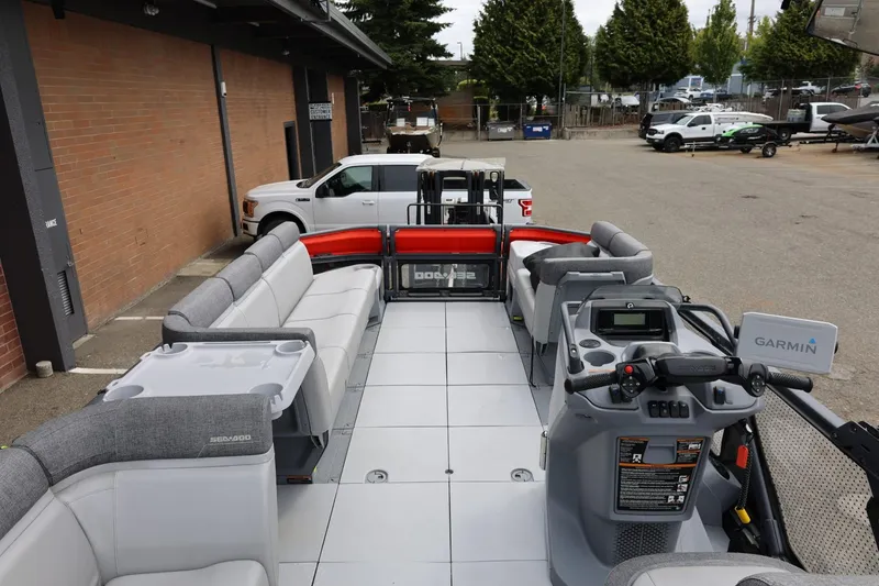 Slide: The Image of 2022 Sea-Doo Switch Cruise 21 pontoon boat with spacious seating and Garmin navigation system. - 14