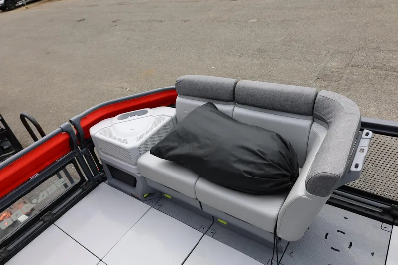 Slide: The Image of 2022 Sea-Doo Switch Cruise 21 interior with gray seating and storage compartment. - 16