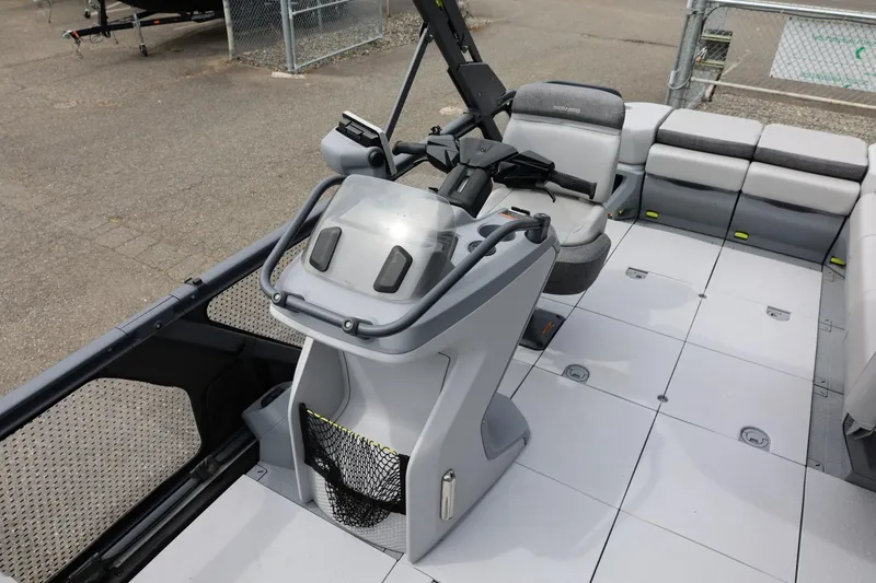 Slide: The Image of 2022 Sea-Doo Switch Cruise 21 interior with steering console and seating area. - 18
