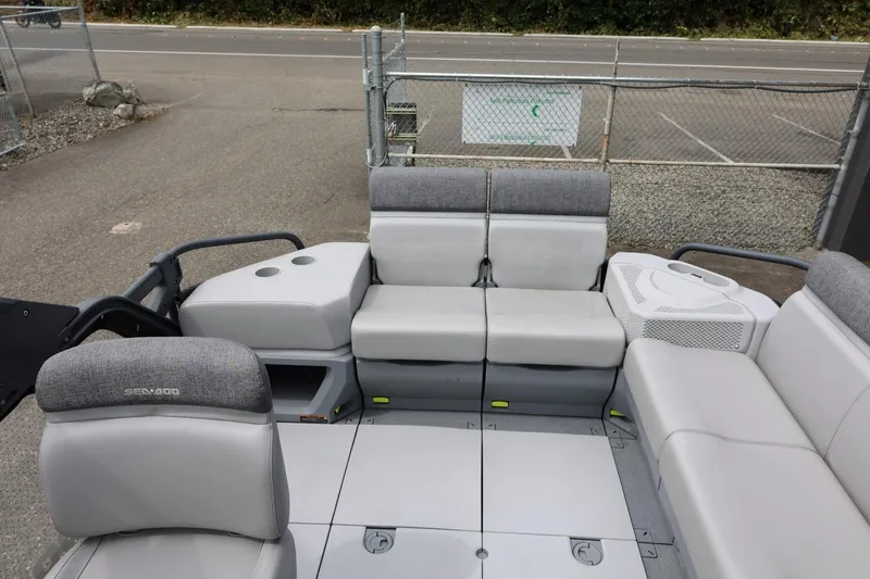 Slide: The Image of 2022 Sea-Doo Switch Cruise 21 interior with gray seating and spacious layout. - 20
