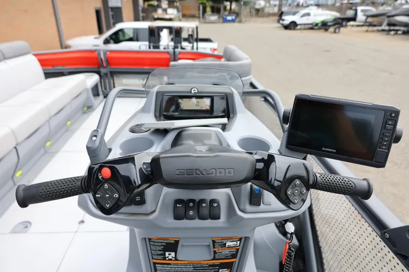 Slide: The Image of 2022 Sea-Doo Switch Cruise 21 dashboard with controls and Garmin display. - 23