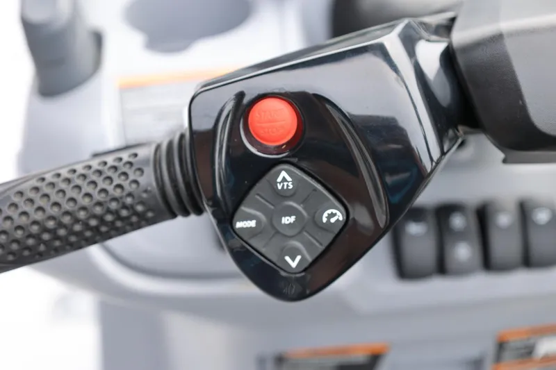 Slide: The Image of Close-up of 2022 Sea-Doo Switch Cruise 21 handlebar controls with buttons and grip. - 24