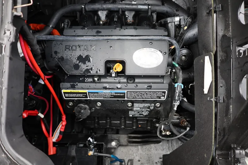 Slide: The Image of Engine compartment of a 2022 Sea-Doo Switch Cruise 21, featuring a Rotax engine. - 29